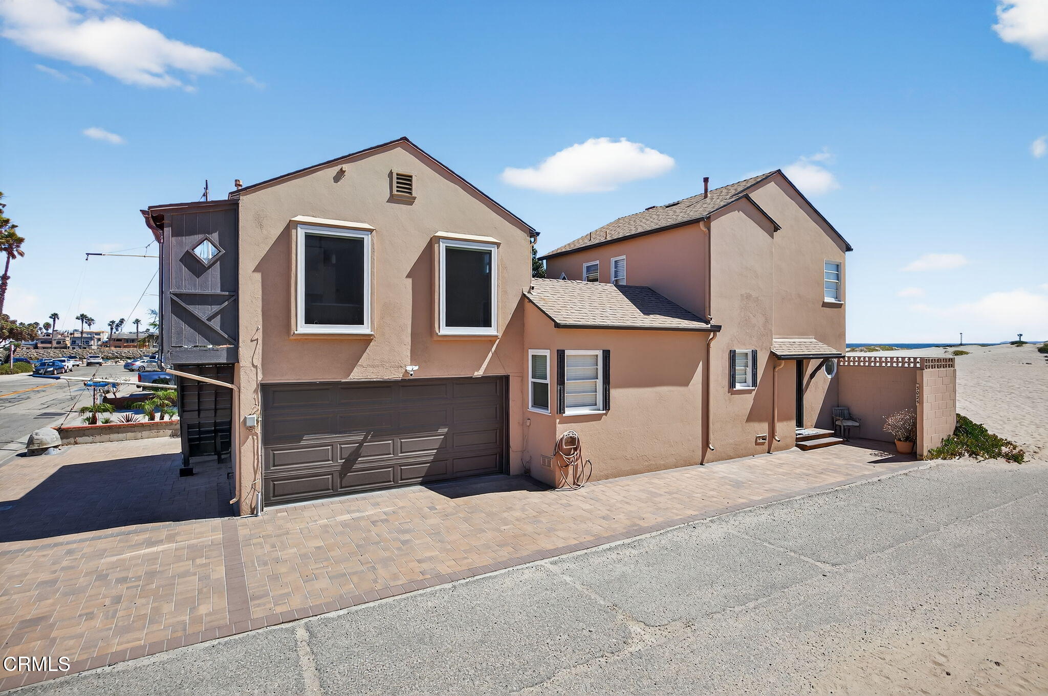 3025 Ocean Drive Oxnard, CA 93035 - Photo 2 of 50 a front view of a house with a yard