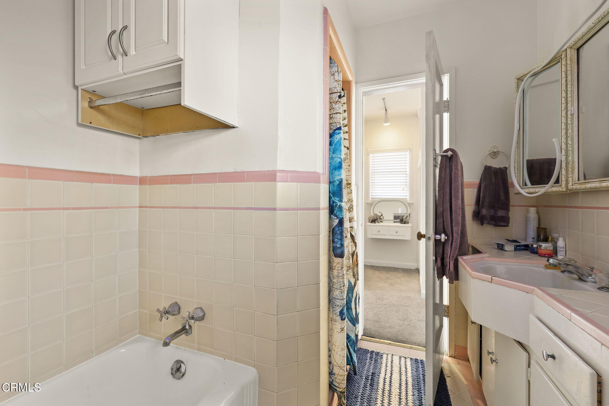 3025 Ocean Drive Oxnard, CA 93035 - Photo 21 of 50 a bathroom with a tub and a sink