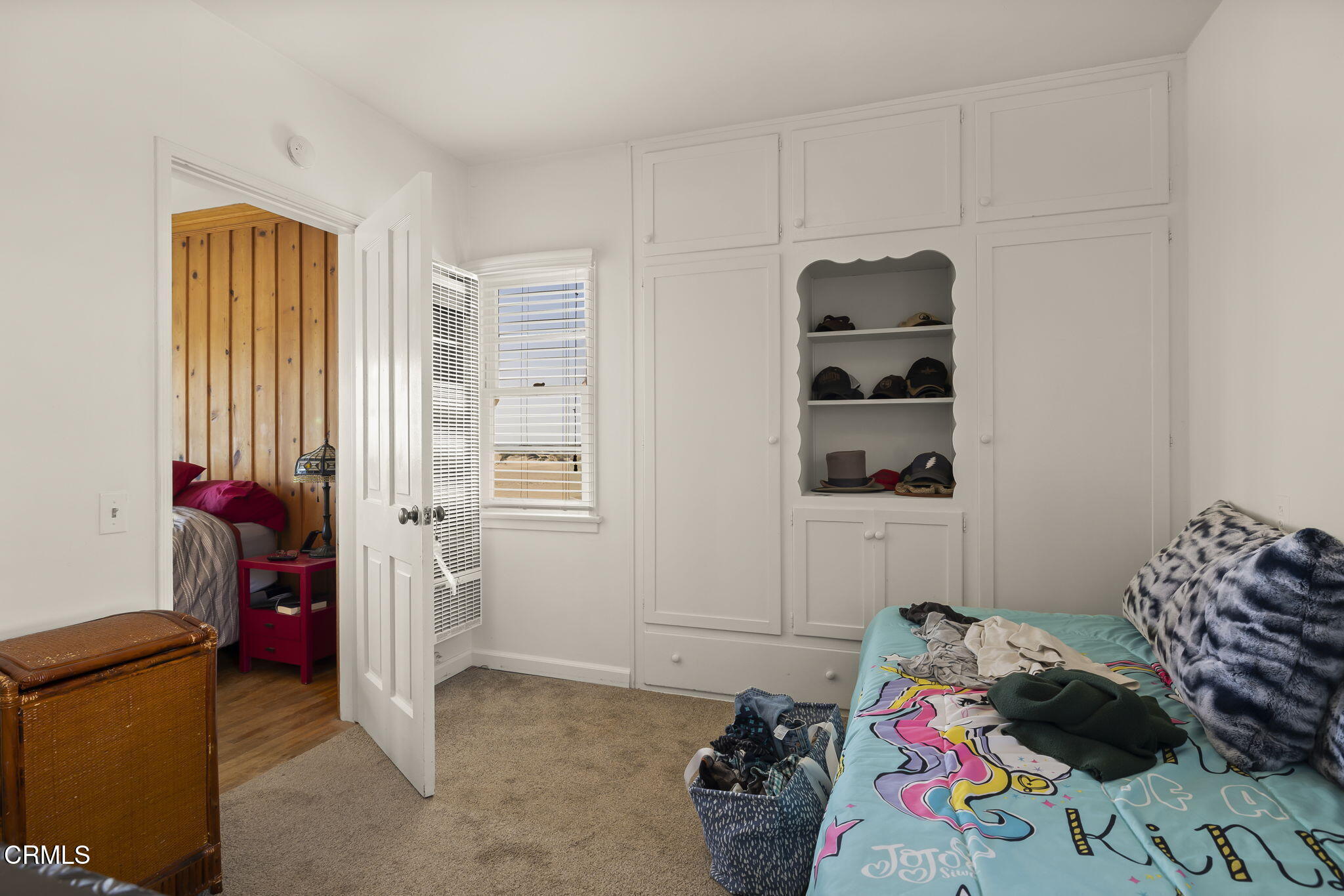 3025 Ocean Drive Oxnard, CA 93035 - Photo 27 of 50 a bedroom with a bed and a window