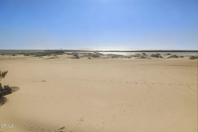 a view of a kitchen with cabinets and wooden floor