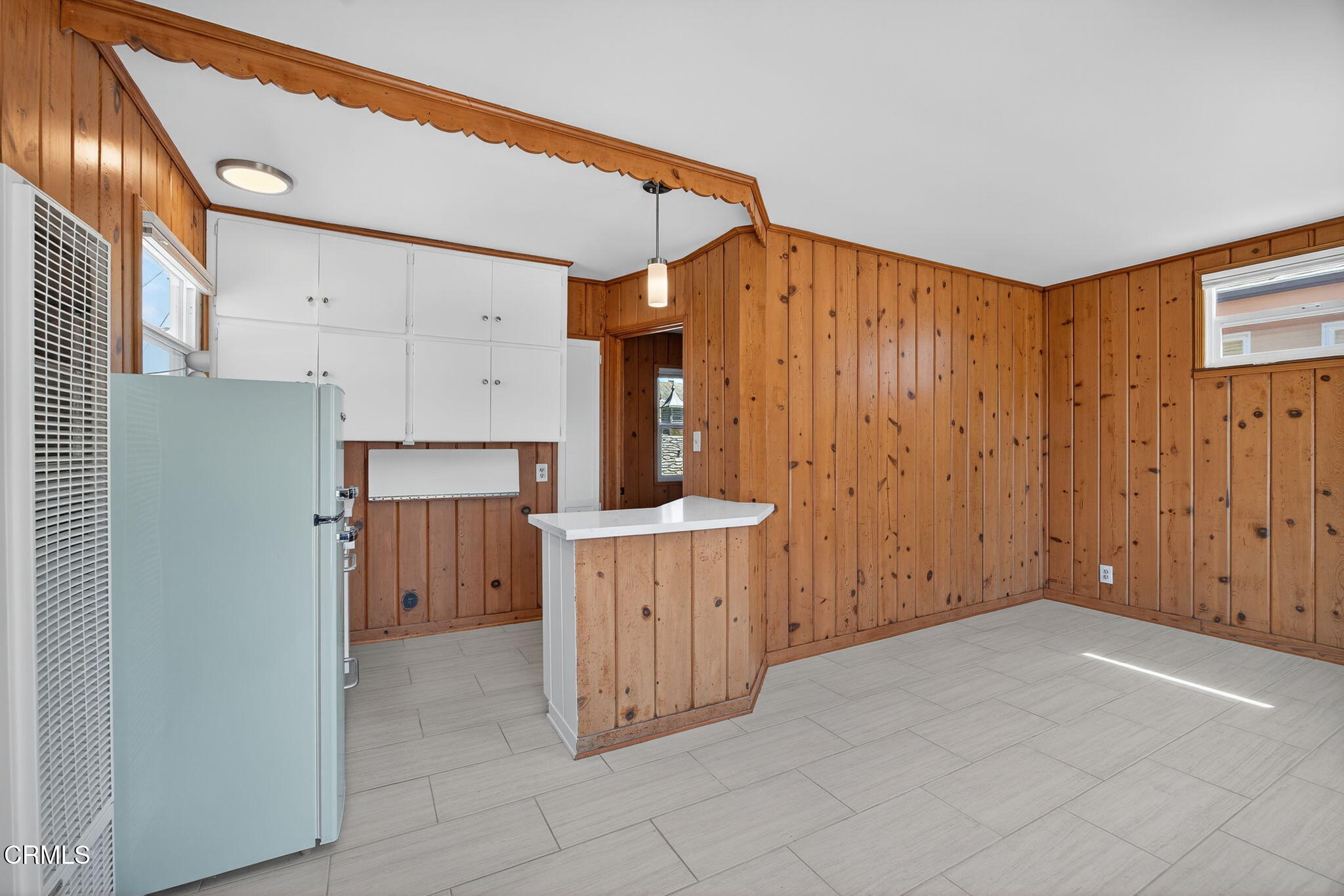 3025 Ocean Drive Oxnard, CA 93035 - Photo 31 of 50 a view of a kitchen with cabinets and wooden floor