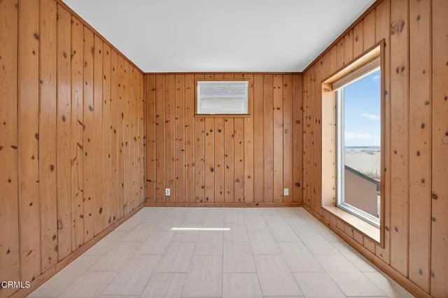 a view of a kitchen with refrigerator and cabinet