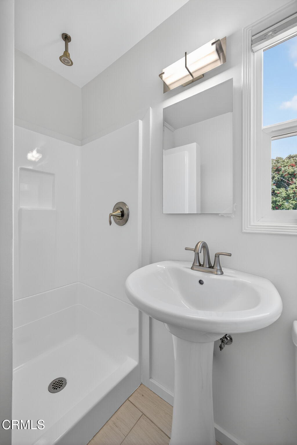 3025 Ocean Drive Oxnard, CA 93035 - Photo 40 of 50 a bathroom with a sink a mirror and shower