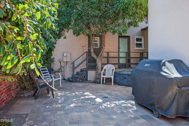 an aerial view of a house with a ocean