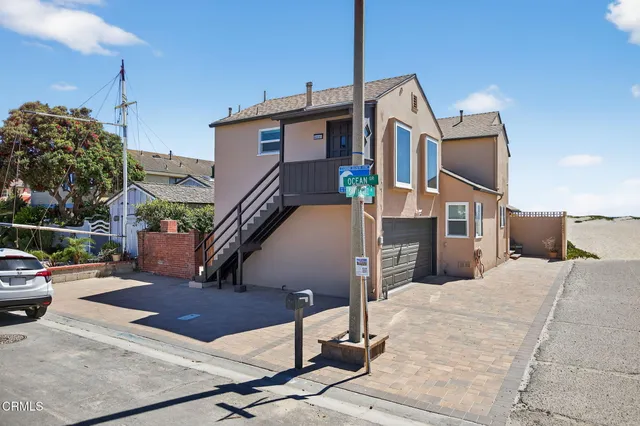 a living room with furniture fireplace and flat screen tv