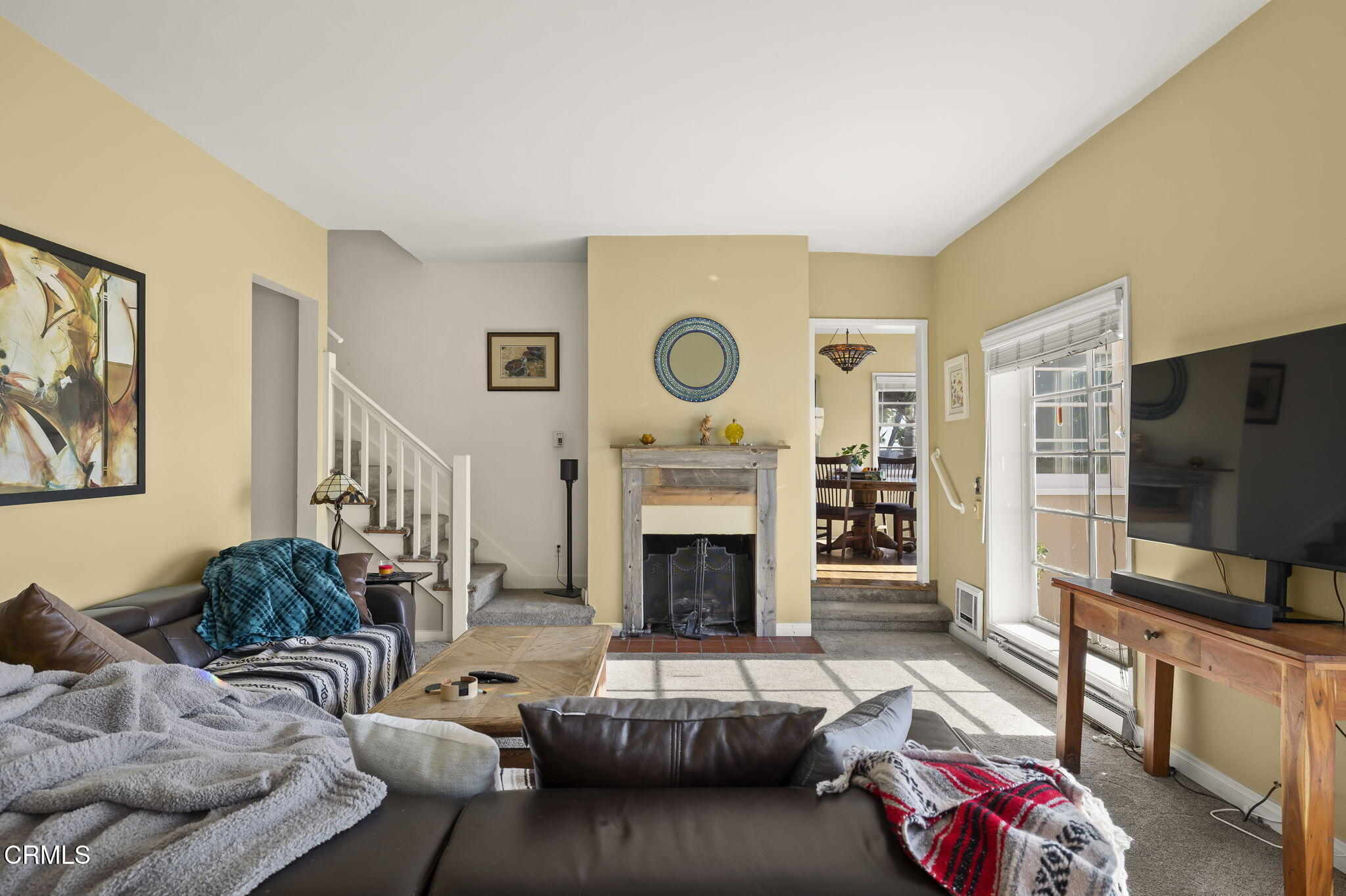 3025 Ocean Drive Oxnard, CA 93035 - Photo 10 of 50 a living room with furniture flat screen tv and a fireplace