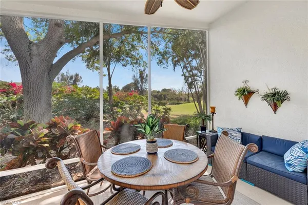 a view of a dining room with furniture window and outside view