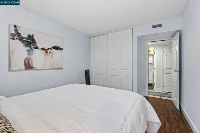 a bed room with a bed and a tv