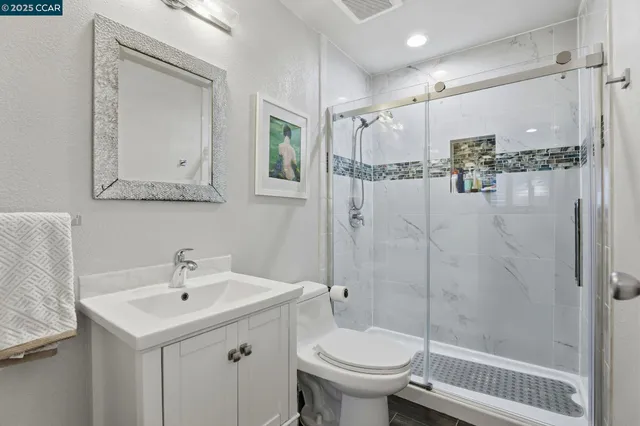 a view of a porch with chairs and potted plants