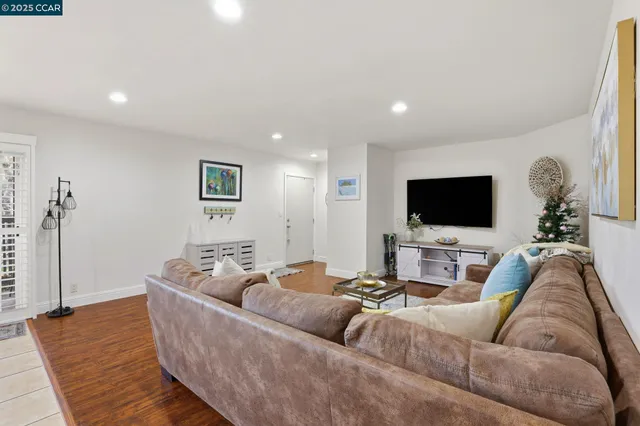 a kitchen with sink a microwave and cabinets