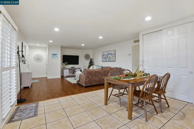 a dining room with furniture and window