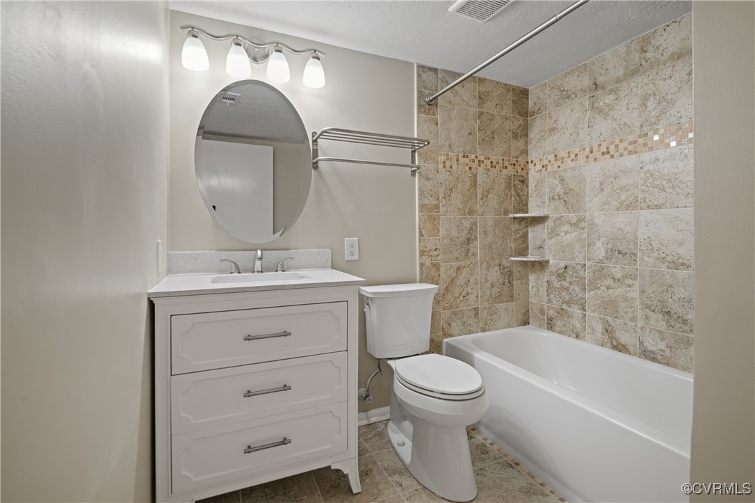 1503 Largo Road, Unit T3 Henrico, VA 23238 - Photo 17 of 33 Full bathroom featuring vanity, toilet, tile patte