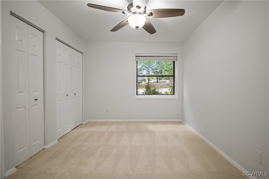 1503 Largo Road, Unit T3 Henrico, VA 23238 - Photo 20 of 33 Unfurnished bedroom with two closets, light carpet