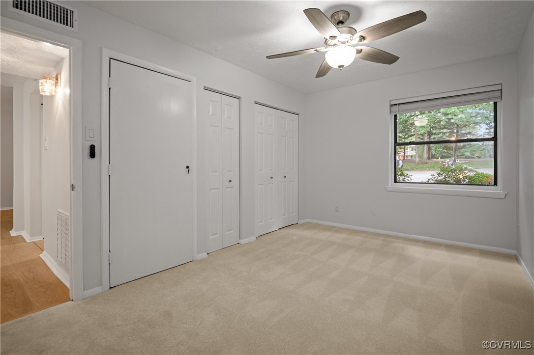 1503 Largo Road, Unit T3 Henrico, VA 23238 - Photo 21 of 33 Unfurnished bedroom featuring two closets, light c