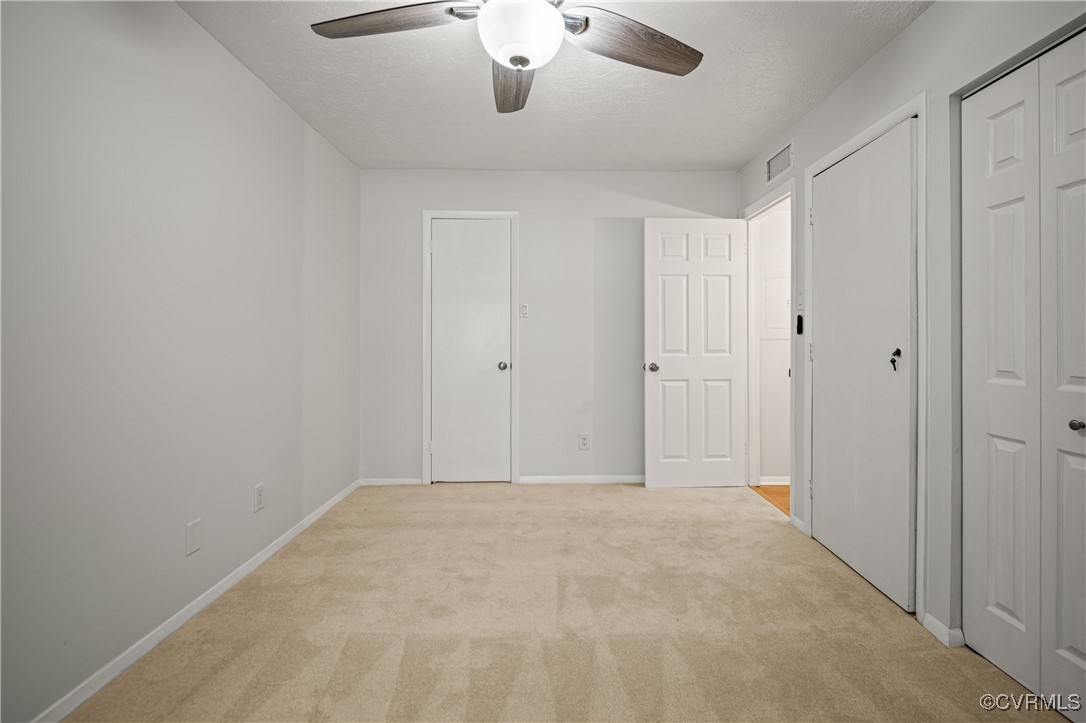 1503 Largo Road, Unit T3 Henrico, VA 23238 - Photo 23 of 33 Unfurnished bedroom featuring light colored carpet
