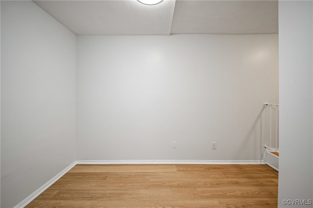 1503 Largo Road, Unit T3 Henrico, VA 23238 - Photo 5 of 33 Empty room with light wood-style flooring and base