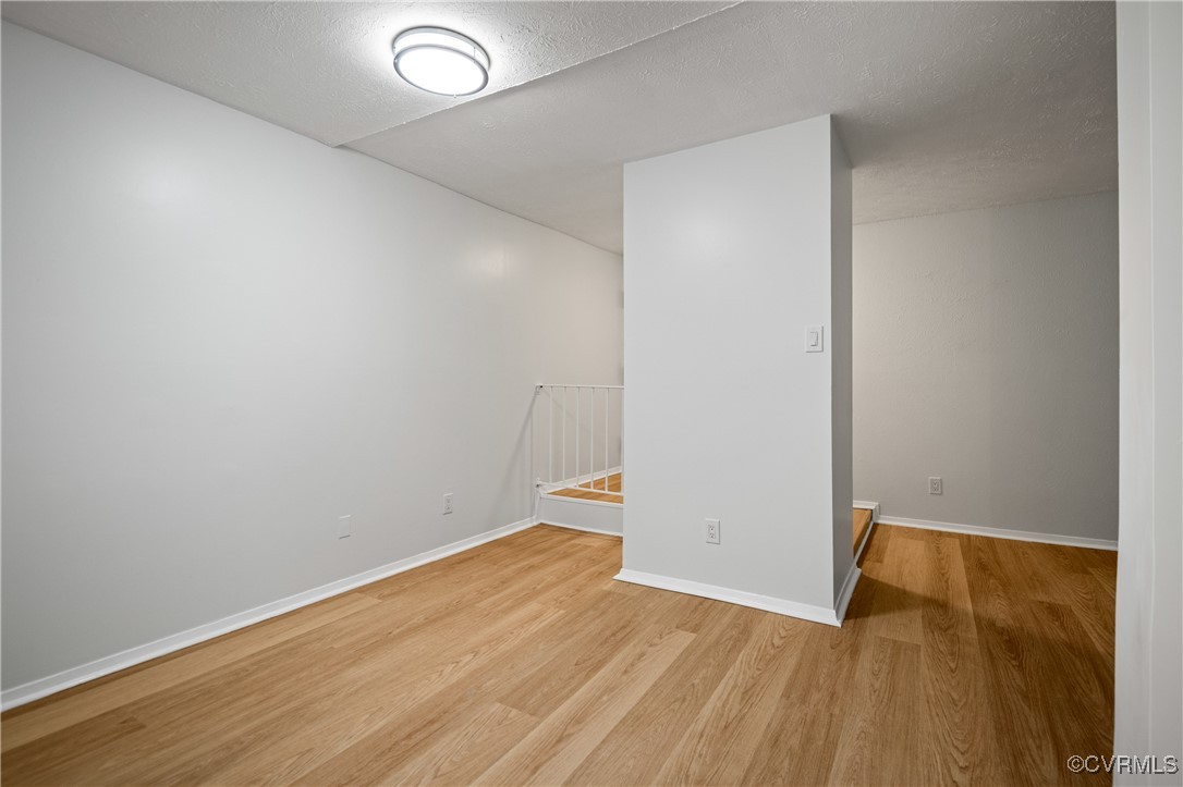 1503 Largo Road, Unit T3 Henrico, VA 23238 - Photo 6 of 33 Spare room featuring light wood-type flooring and