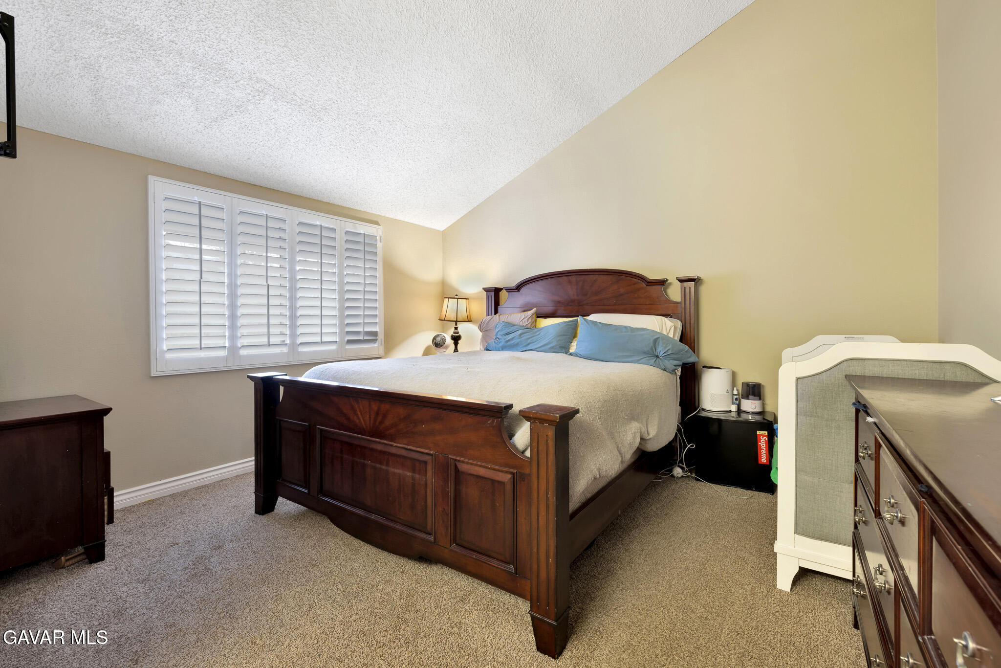 14425 Foothill Boulevard, Unit 17 Sylmar, CA 91342 - Photo 12 of 27 a bedroom with a bed and a window