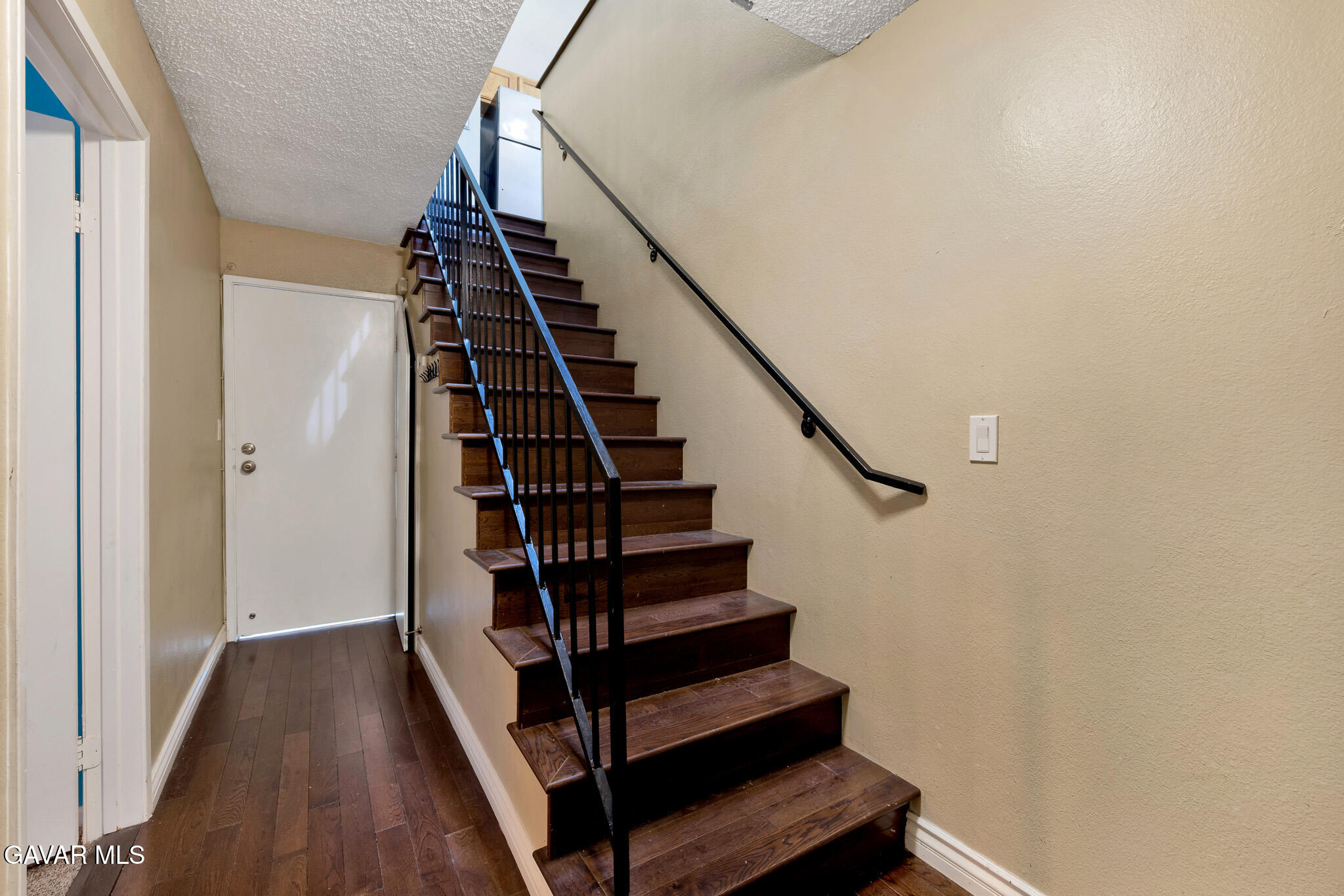14425 Foothill Boulevard, Unit 17 Sylmar, CA 91342 - Photo 19 of 27 a view of entryway with wooden floor