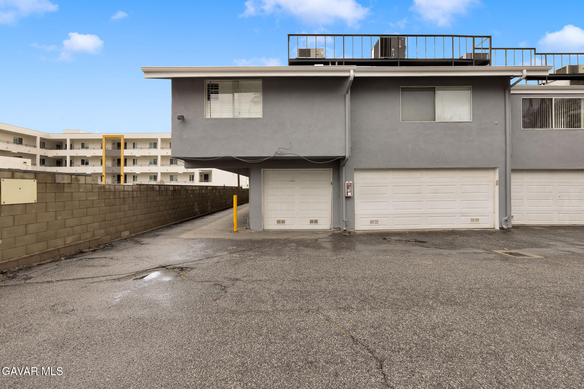 14425 Foothill Boulevard, Unit 17 Sylmar, CA 91342 - Photo 25 of 27 a front view of a house with parking area