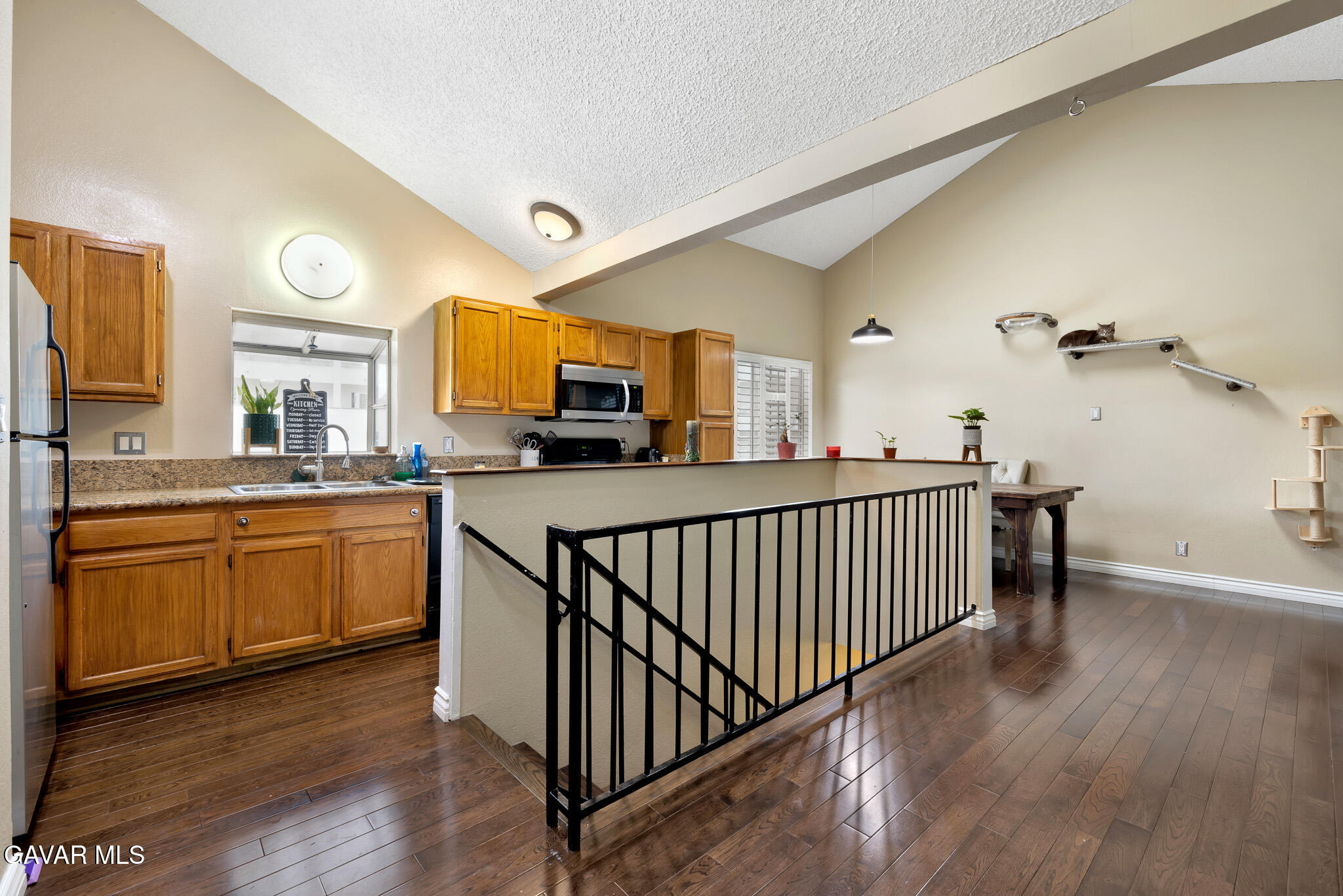 14425 Foothill Boulevard, Unit 17 Sylmar, CA 91342 - Photo 7 of 27 a kitchen with stainless steel appliances granite countertop a sink and cabinets
