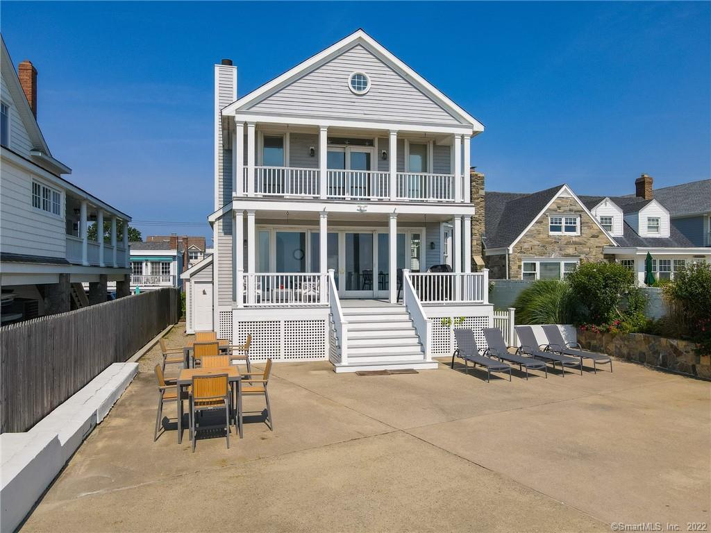 515 Fairfield Beach Road Fairfield, CT 06824 - Photo 1 of 1 a front view of a house with a yard
