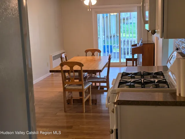 a dining room with furniture and a fireplace