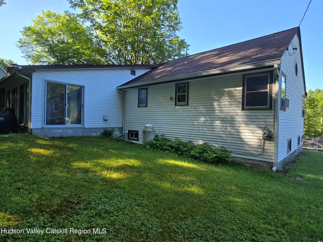 a backyard of a house with lots of green space