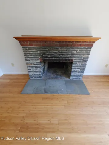 a view of fireplace and wooden floor