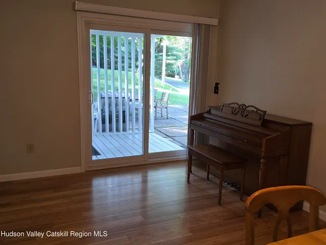a room with wooden floor and a chair