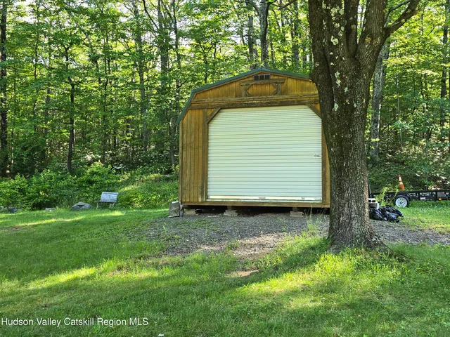 a backyard of a house with seating space