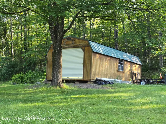 a backyard of a house with dishwasher and garden