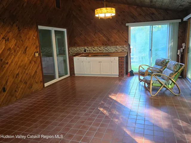 an entryway with wooden floor