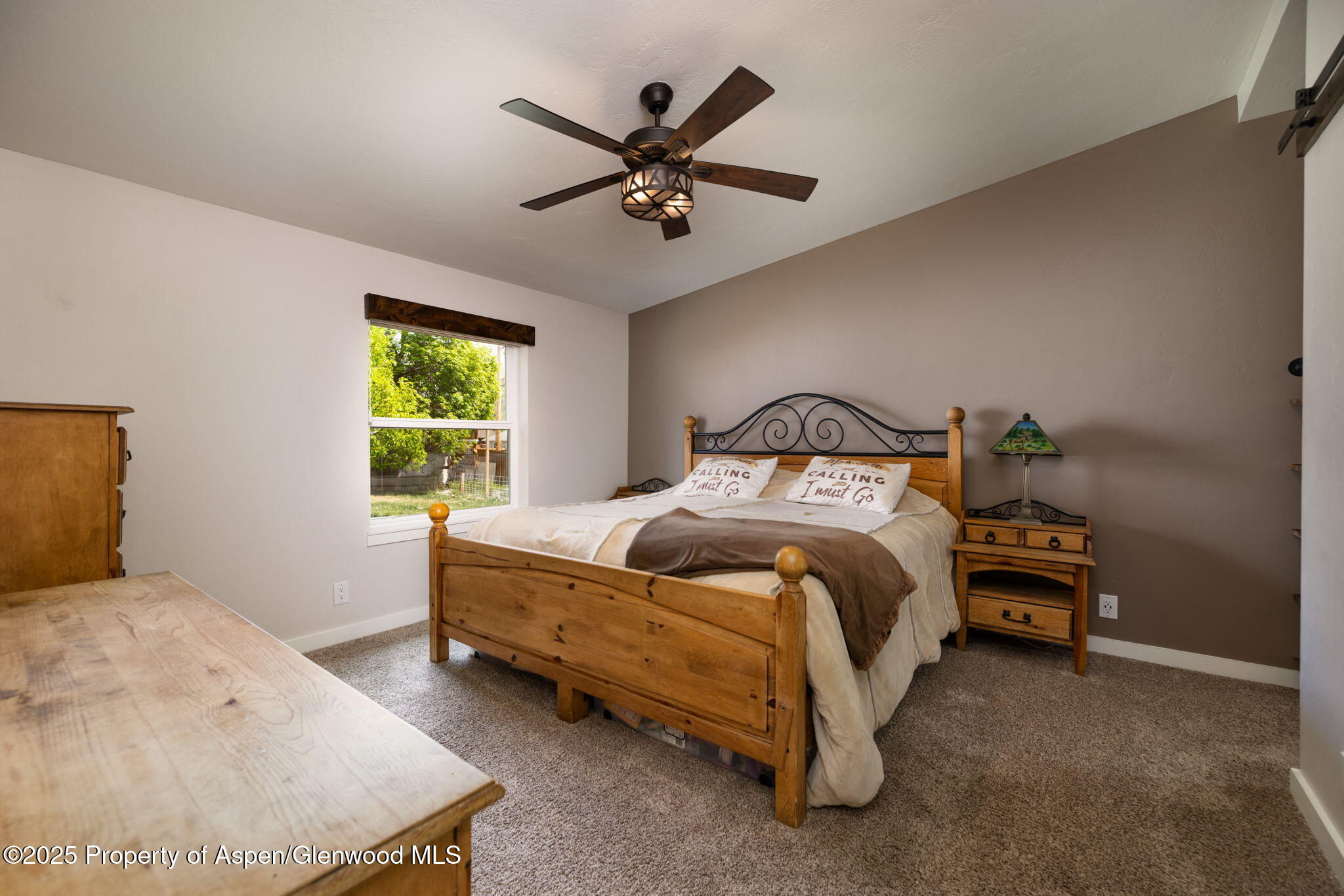 330 Will Avenue Rifle, CO 81650 - Photo 13 of 27 a bedroom with a bed and window