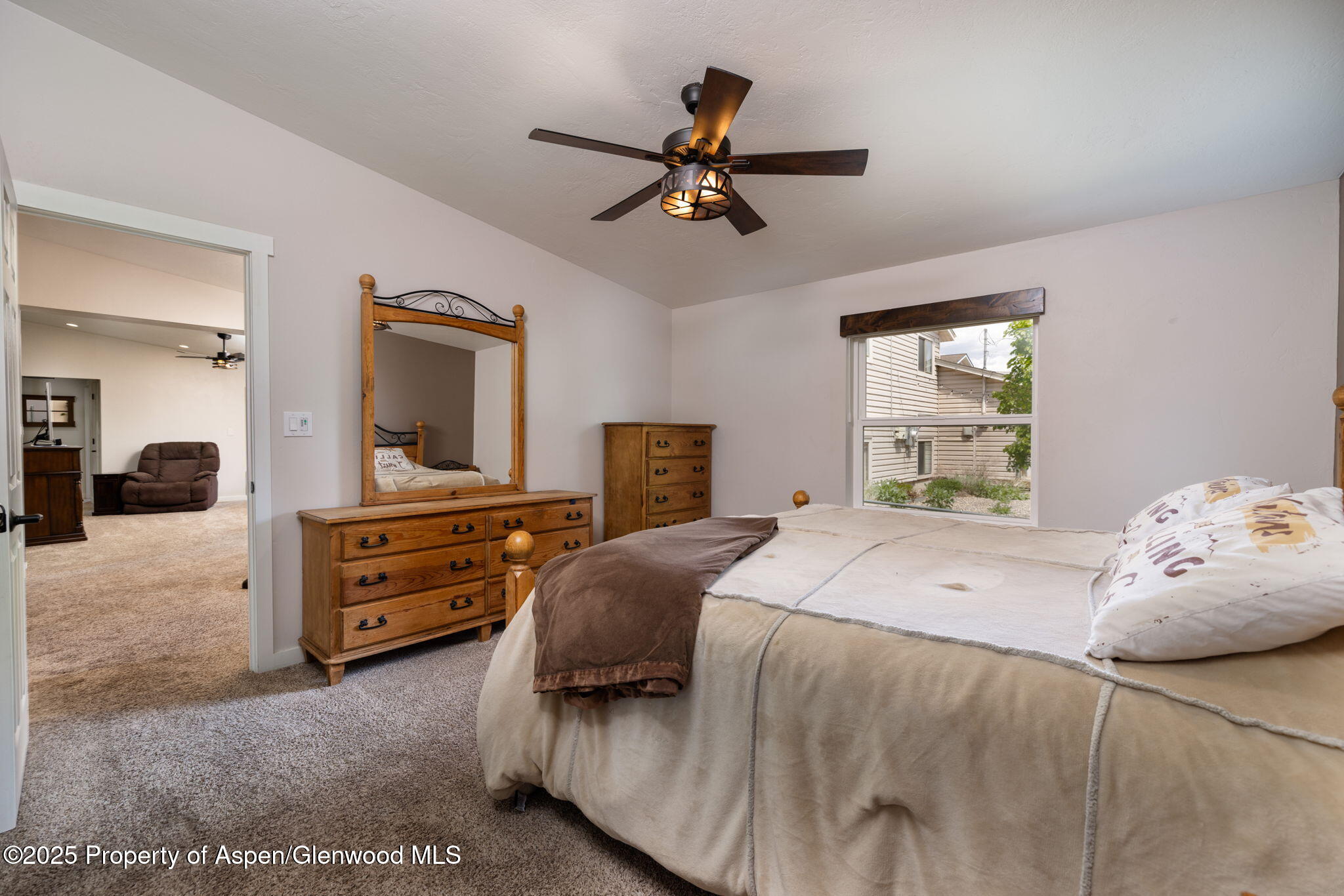 330 Will Avenue Rifle, CO 81650 - Photo 14 of 27 a bedroom with a bed and window