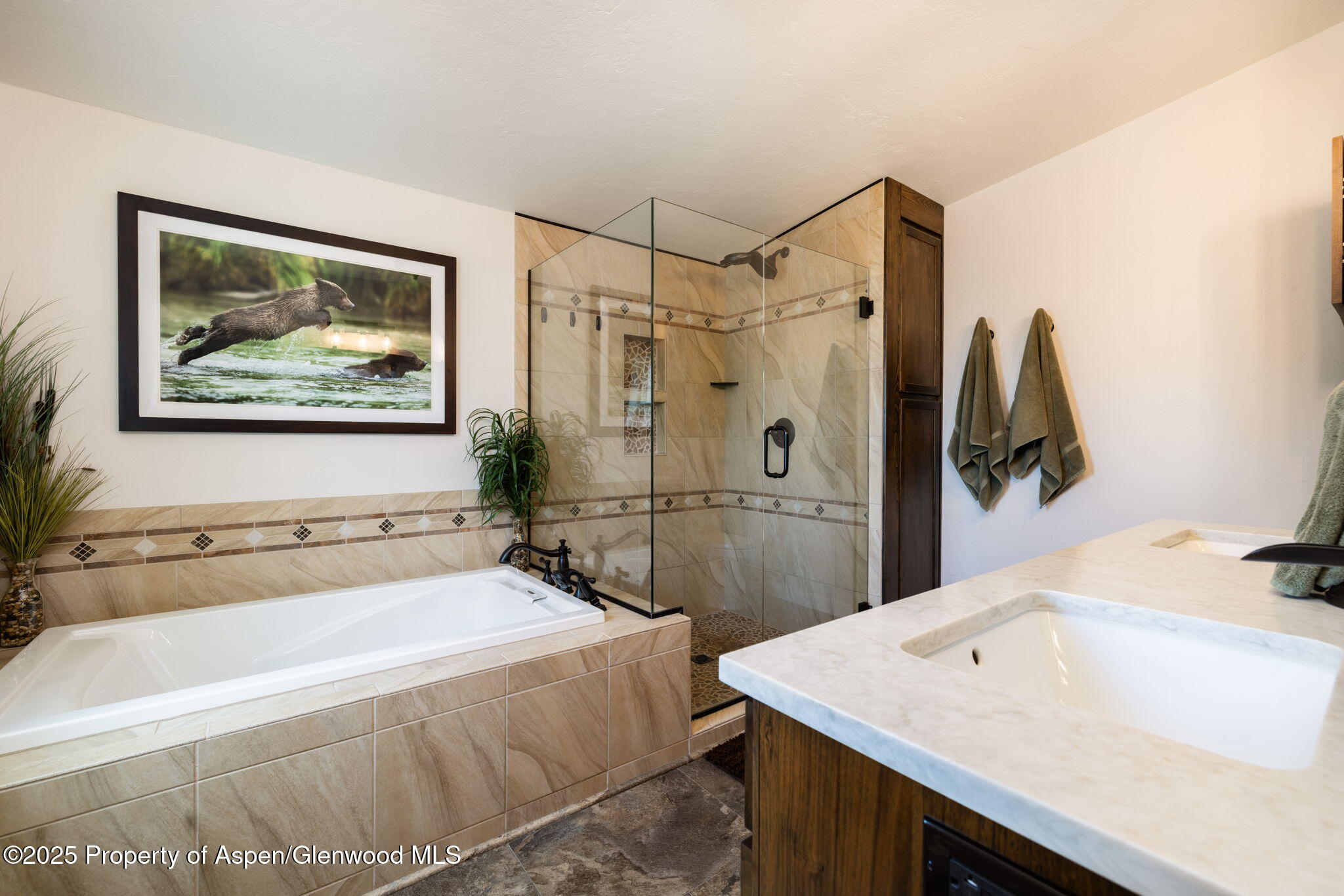 330 Will Avenue Rifle, CO 81650 - Photo 15 of 27 a bathroom with a tub a sink and mirror