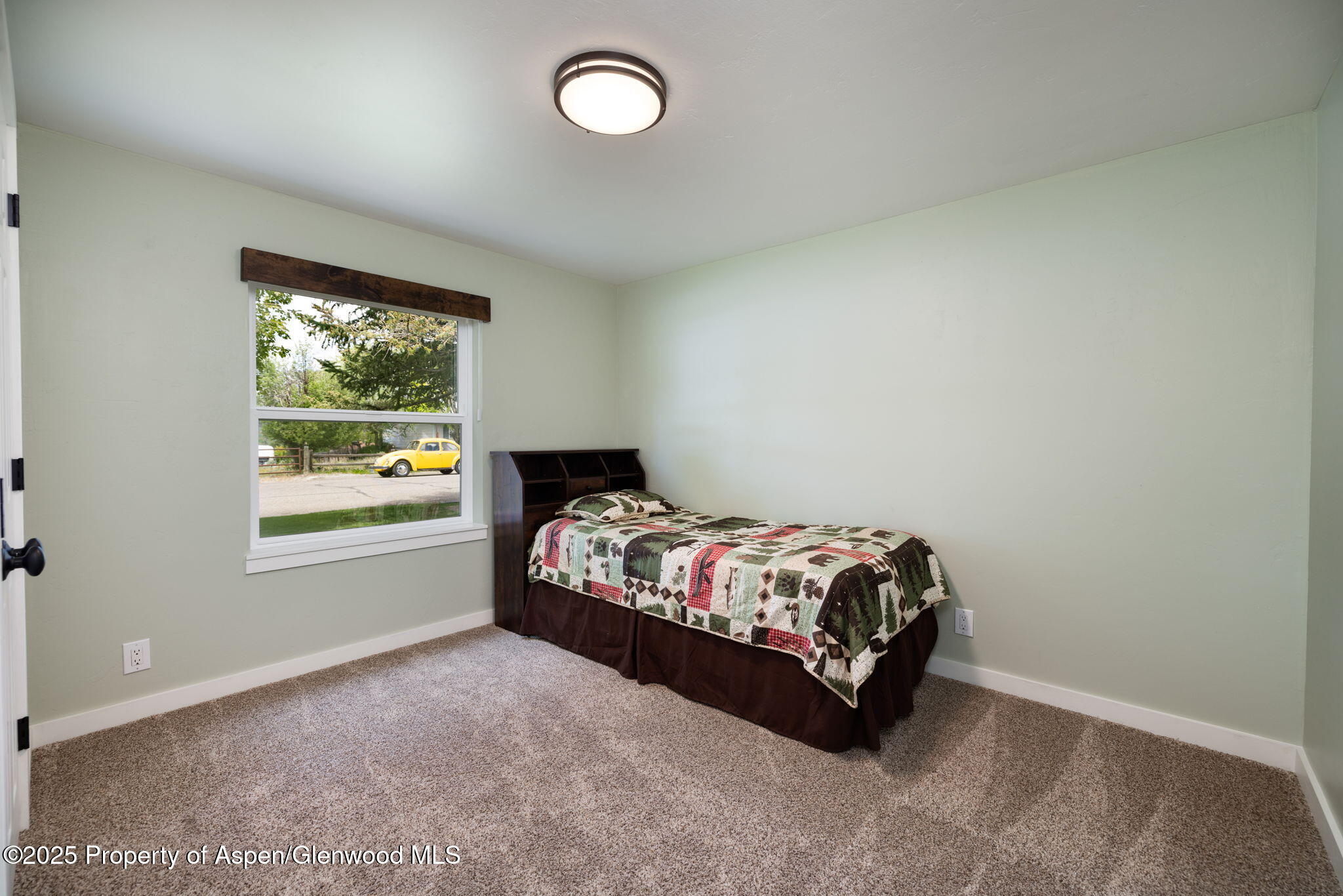 330 Will Avenue Rifle, CO 81650 - Photo 19 of 27 a bedroom with a bed and window