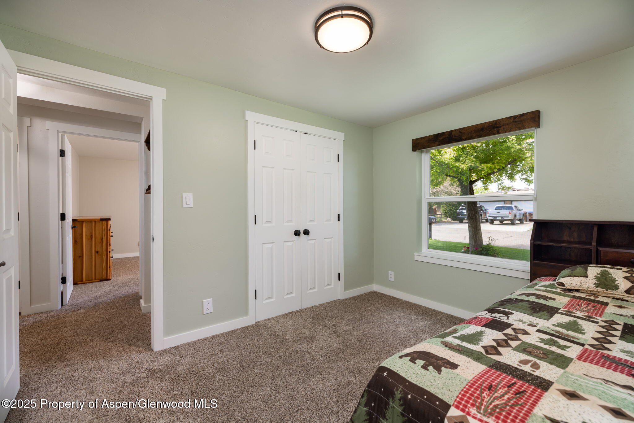 330 Will Avenue Rifle, CO 81650 - Photo 20 of 27 a bedroom with a bed and a window