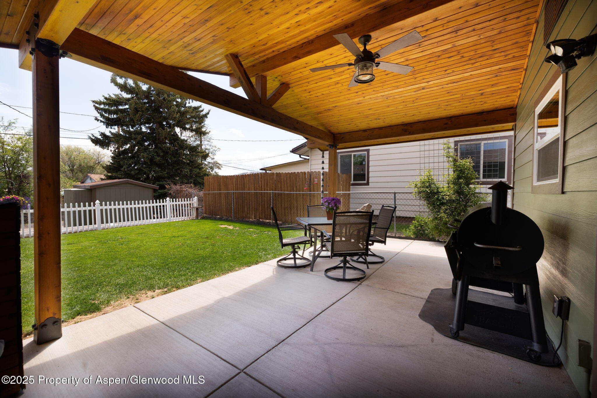 330 Will Avenue Rifle, CO 81650 - Photo 22 of 27 a view of a backyard with sitting area and garden