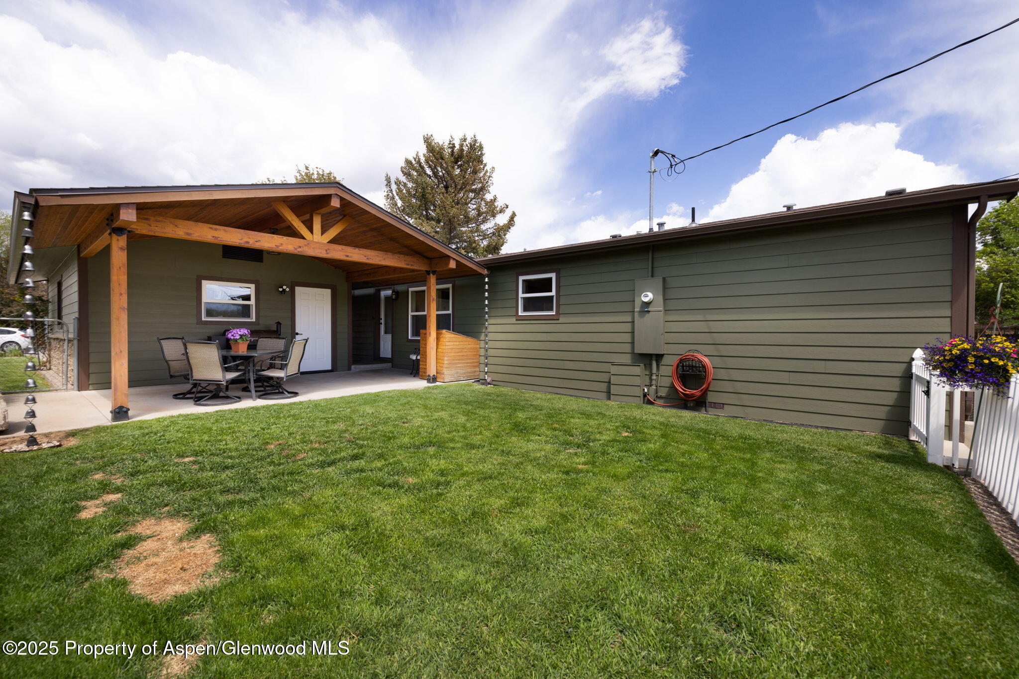 330 Will Avenue Rifle, CO 81650 - Photo 23 of 27 a view of a house with backyard and porch