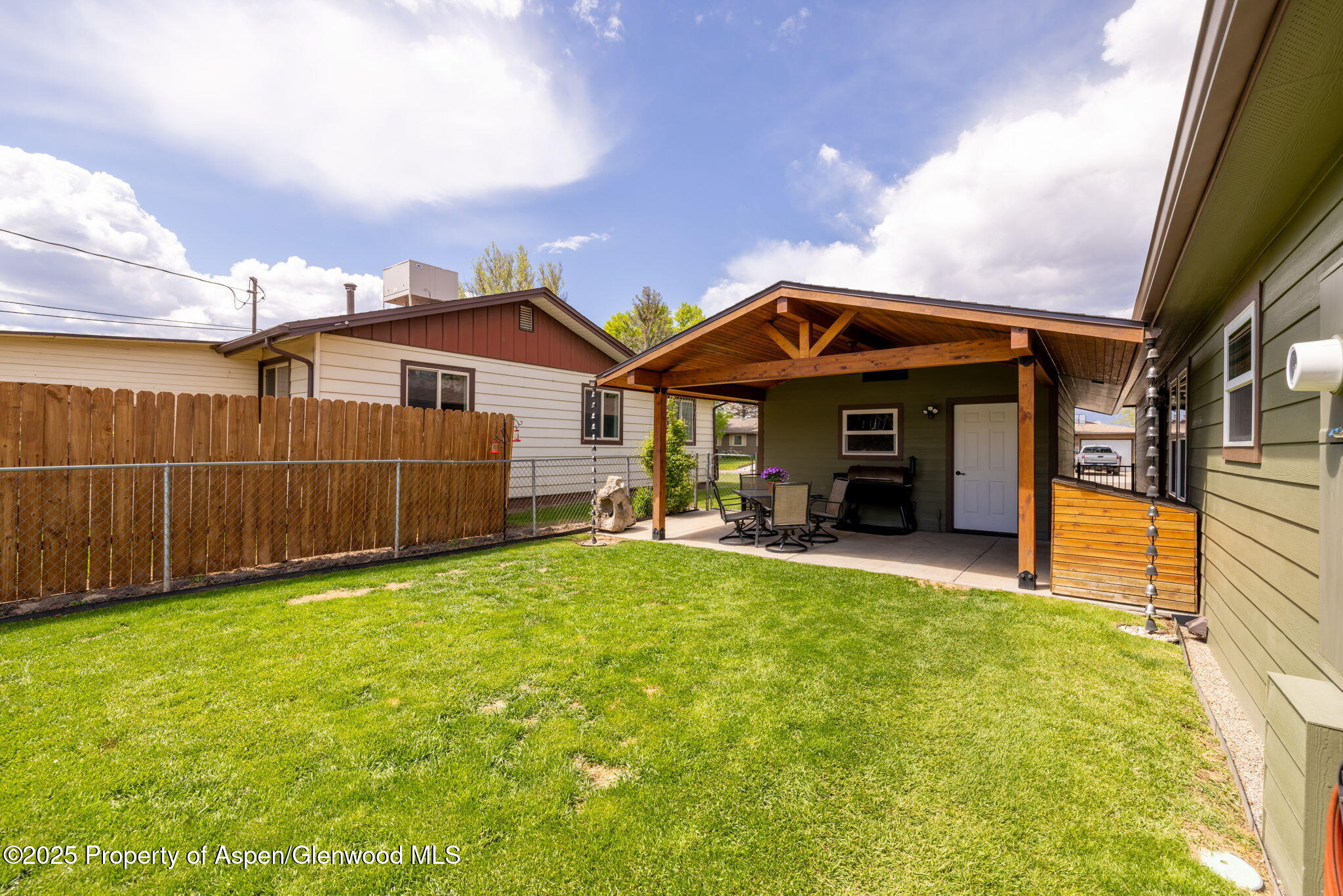 330 Will Avenue Rifle, CO 81650 - Photo 24 of 27 a view of a house with backyard and porch