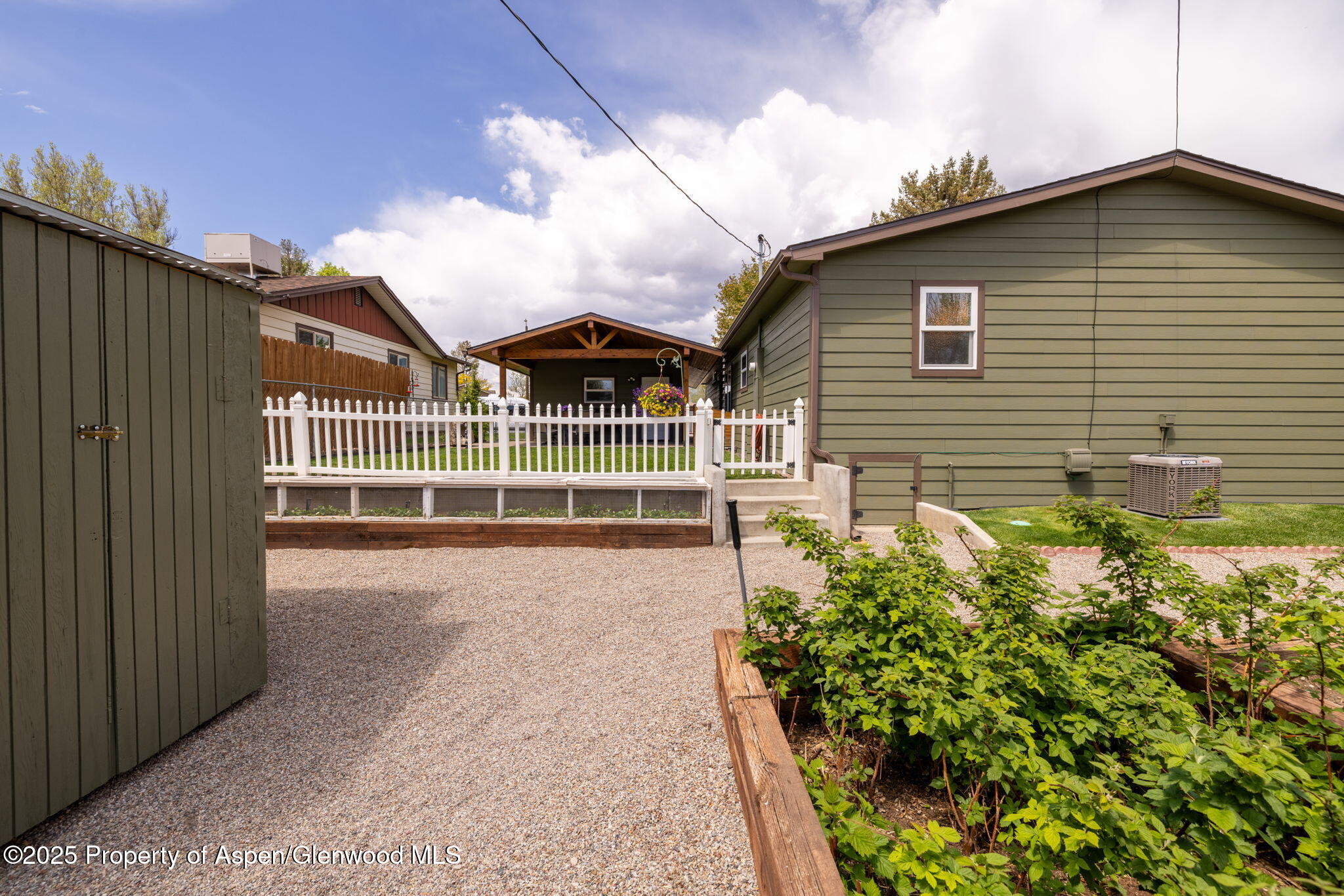 330 Will Avenue Rifle, CO 81650 - Photo 25 of 27 a front view of a house with a garden