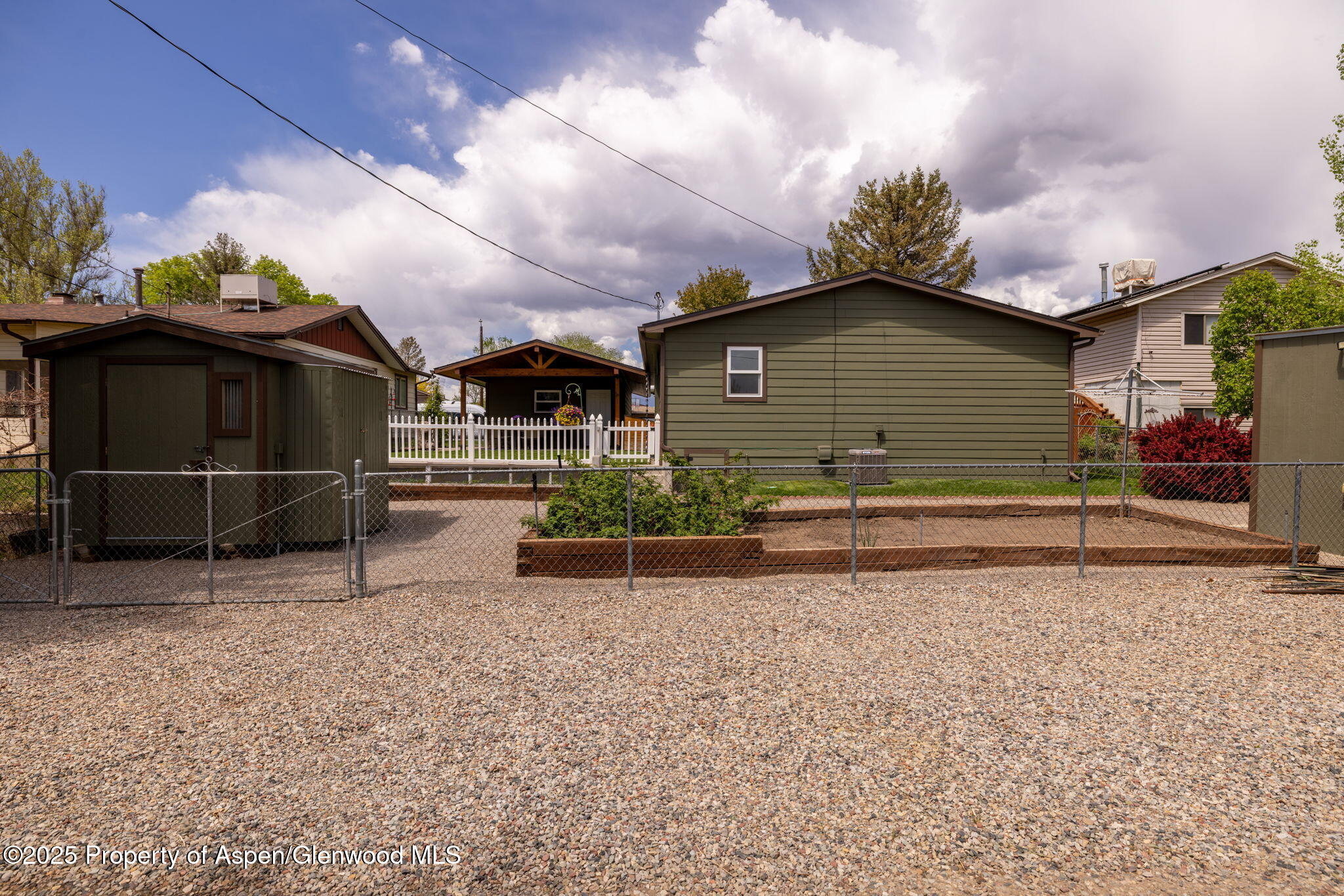 330 Will Avenue Rifle, CO 81650 - Photo 27 of 27 a view of a house with a yard and wooden fence