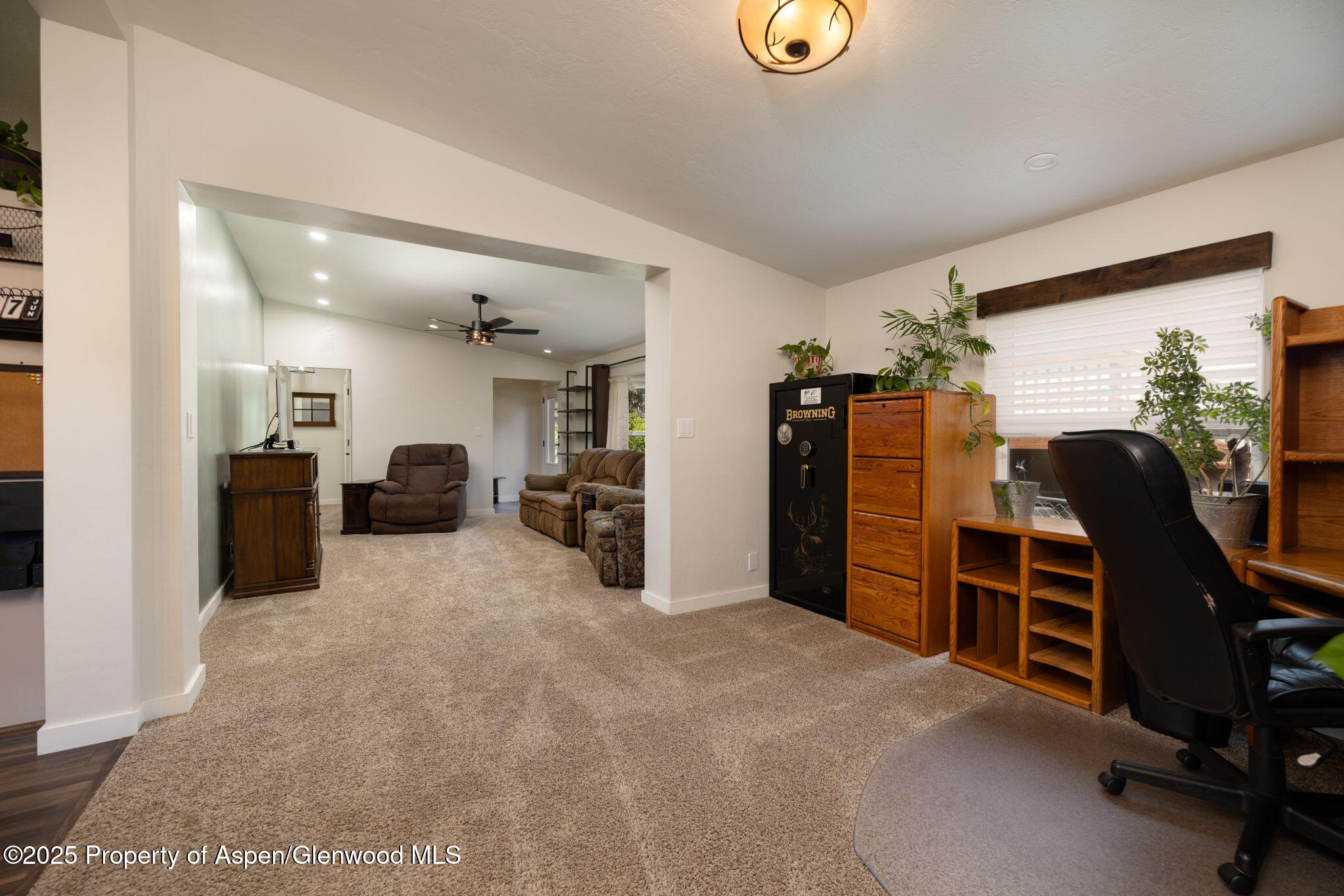 330 Will Avenue Rifle, CO 81650 - Photo 6 of 27 a view of a livingroom with furniture and windows