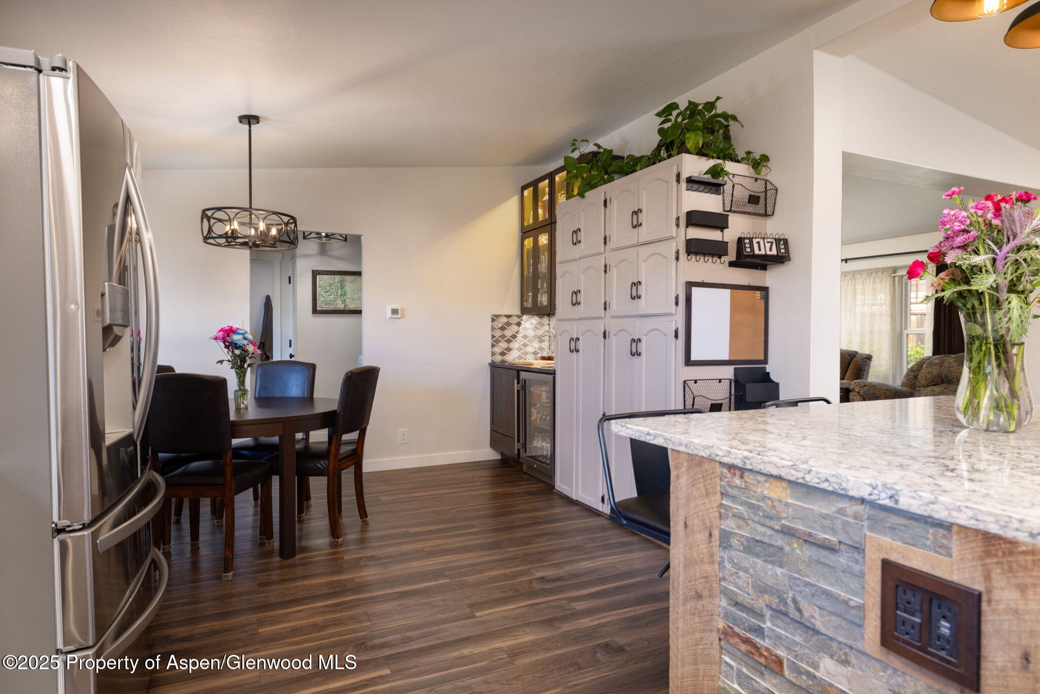 330 Will Avenue Rifle, CO 81650 - Photo 9 of 27 a view of a dining room with furniture and wooden floor