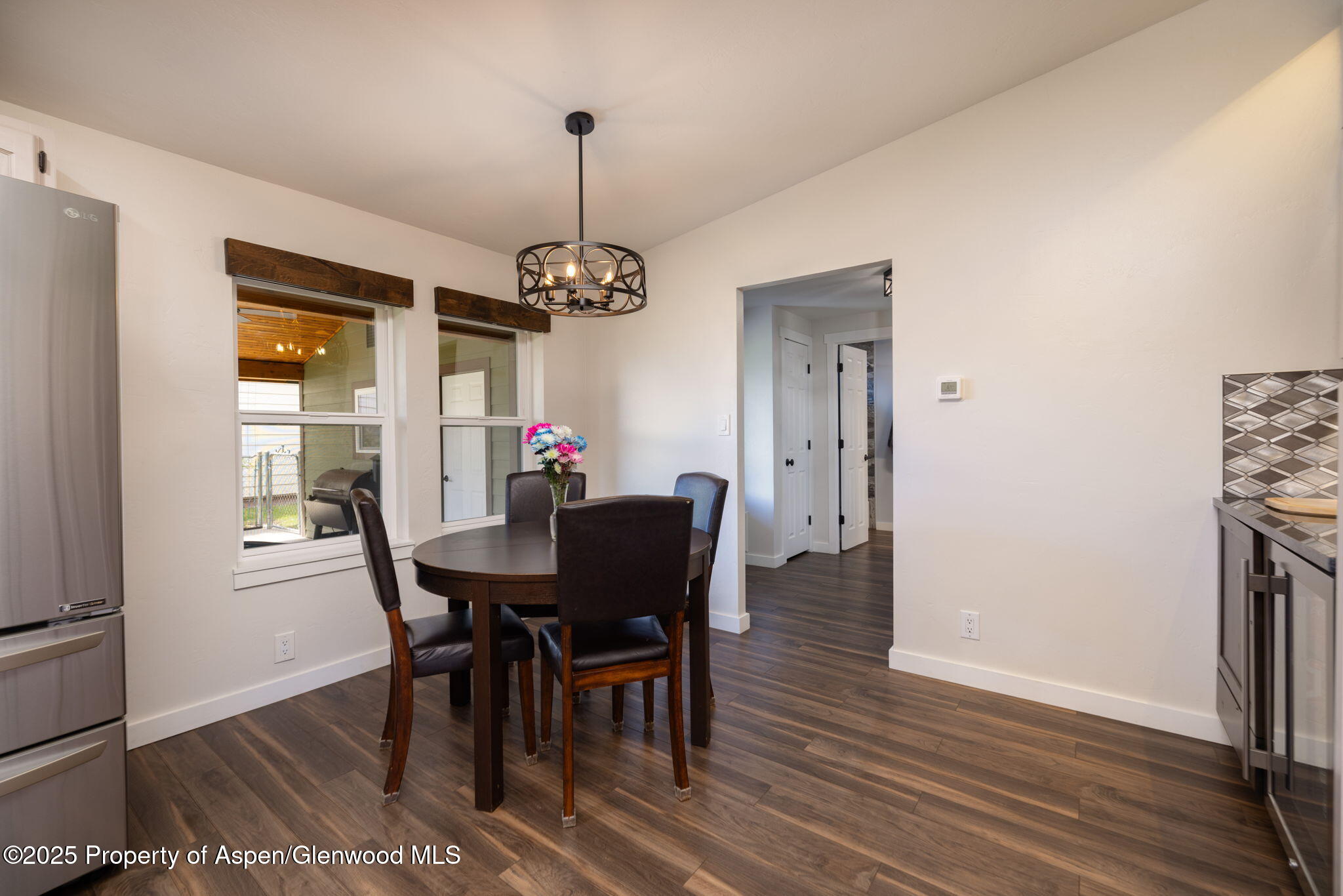330 Will Avenue Rifle, CO 81650 - Photo 10 of 27 a view of a dining room with furniture window and wooden floor