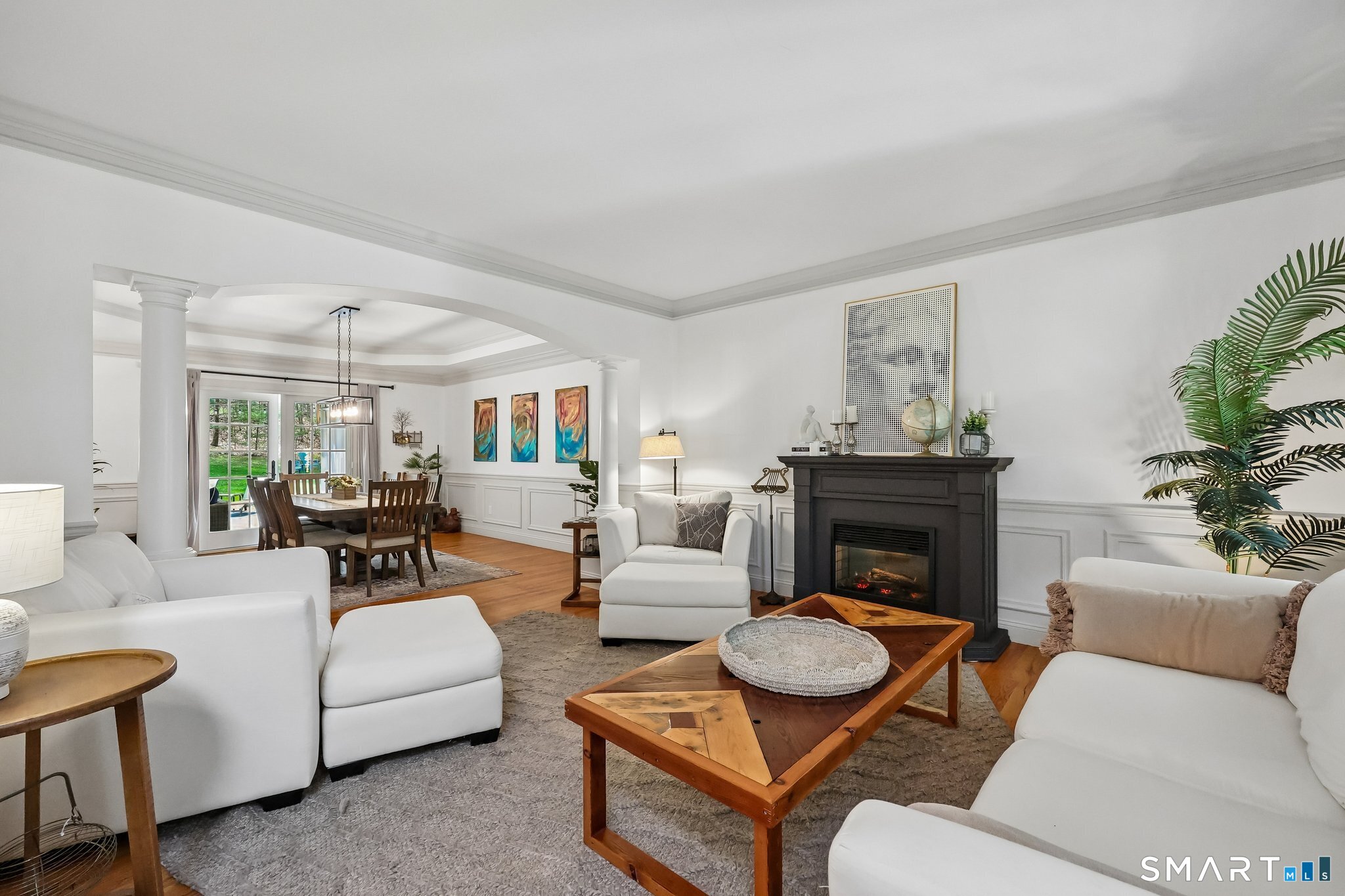 3 East Lake Road Danbury, CT 06811 - Photo 5 of 37 The formal living room offers a refined setting with elegant proportions, abundant natural light, and a timeless atmosphere ideal for both entertaining and quiet gatherings.