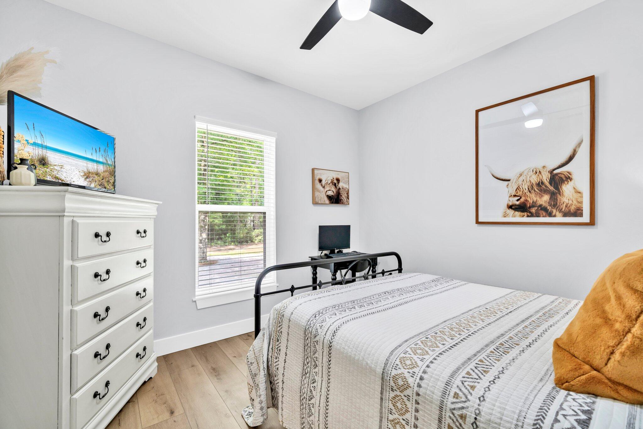 52 Lazy Bone St Point Vernon, FL 32462 - Photo 13 of 62 a bedroom with a bed and a dresser