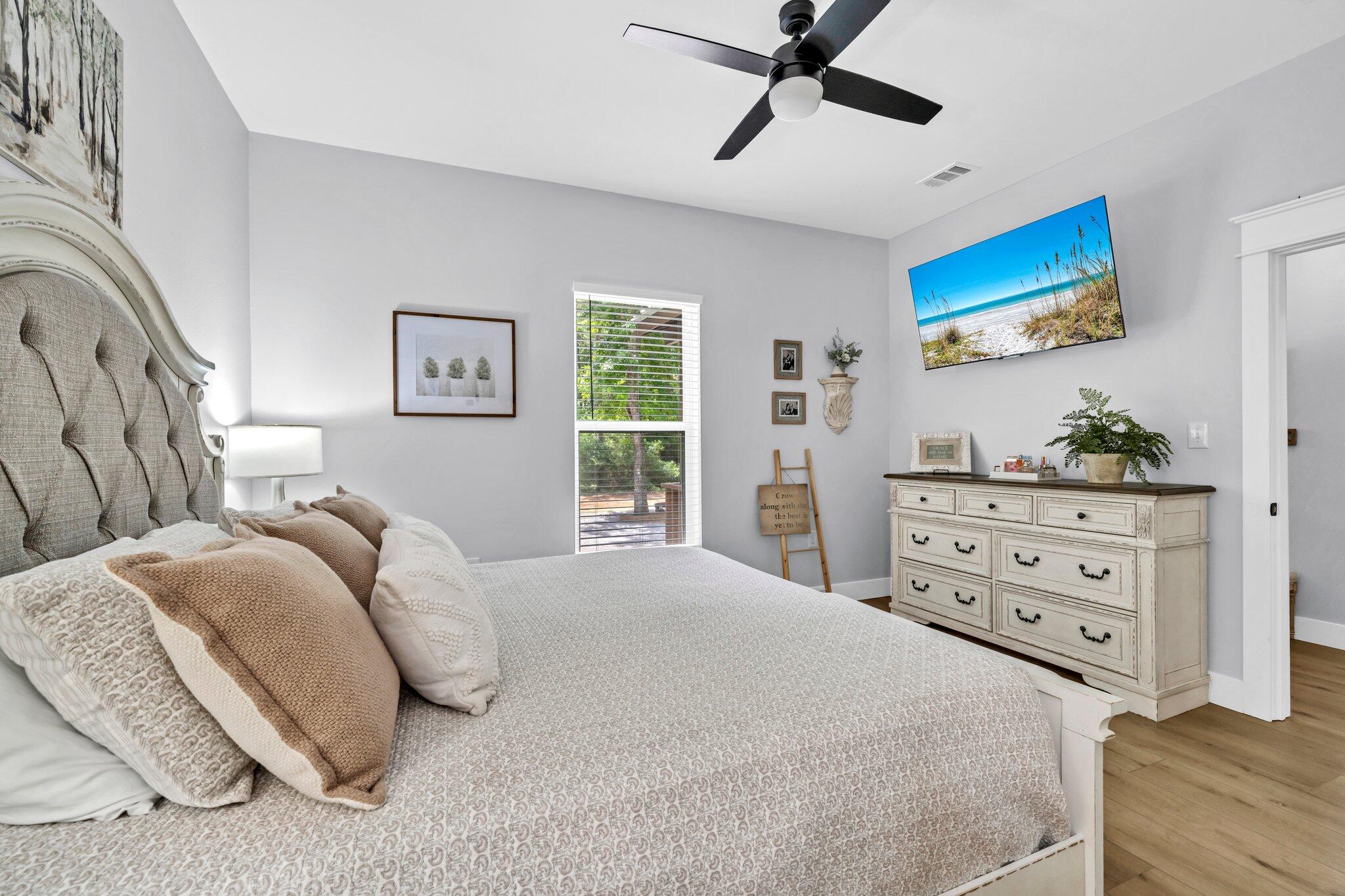 52 Lazy Bone St Point Vernon, FL 32462 - Photo 15 of 62 a bedroom with a bed and a dresser