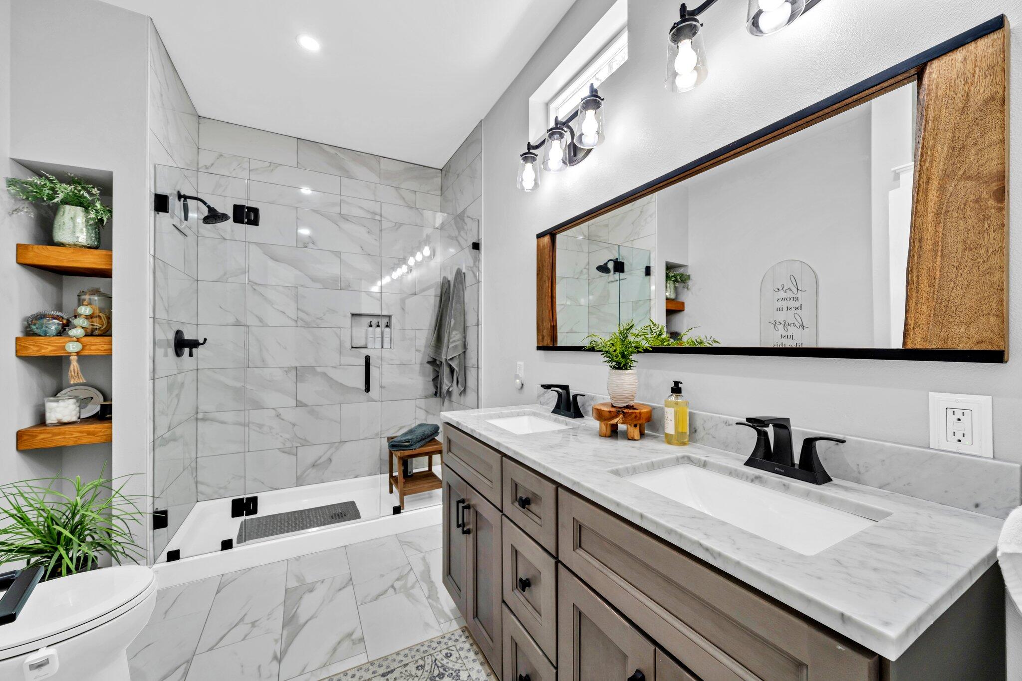 52 Lazy Bone St Point Vernon, FL 32462 - Photo 16 of 62 a bathroom with a granite countertop sink a mirror and shower